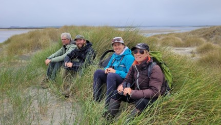 The team hunkering down at the Te Whanga Lagoon Mouth looking for Banded Dotterels