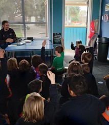 Tim with kids at school